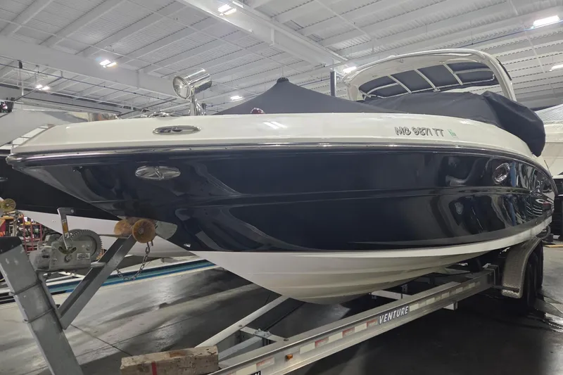 Slide: The Image of 2008 Sea Ray 300 Select EX boat on trailer in indoor storage facility. - 13