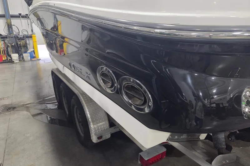 Slide: The Image of 2008 Sea Ray 300 Select EX boat on trailer in a garage setting. - 2