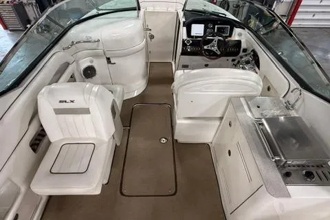 Slide: The Image of 2008 Sea Ray 300 Select EX boat interior with helm, seating, and kitchenette. - 4