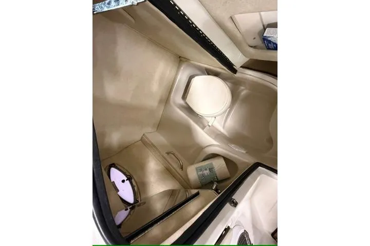Slide: The Image of Interior of 2008 Sea Ray 300 Select EX boat bathroom with toilet and storage. - 9