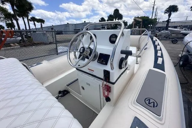 Slide: The Image of 2015 Novurania DL 460 boat interior with steering wheel and control panel. - 3