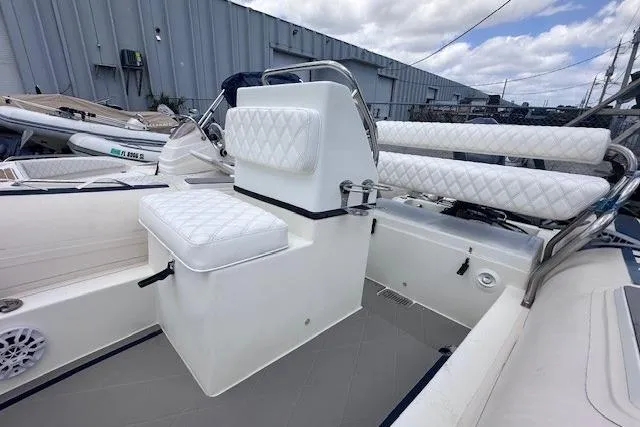 Slide: The Image of 2015 Novurania DL 460 boat interior with white quilted seating and modern design. - 5