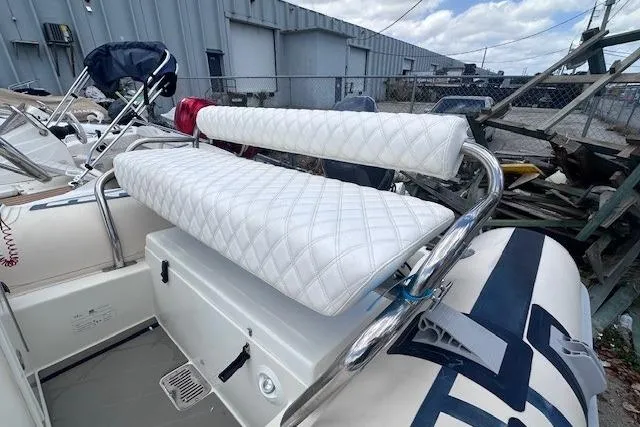Slide: The Image of 2015 Novurania DL 460 boat with white quilted seating and stainless steel frame. - 8