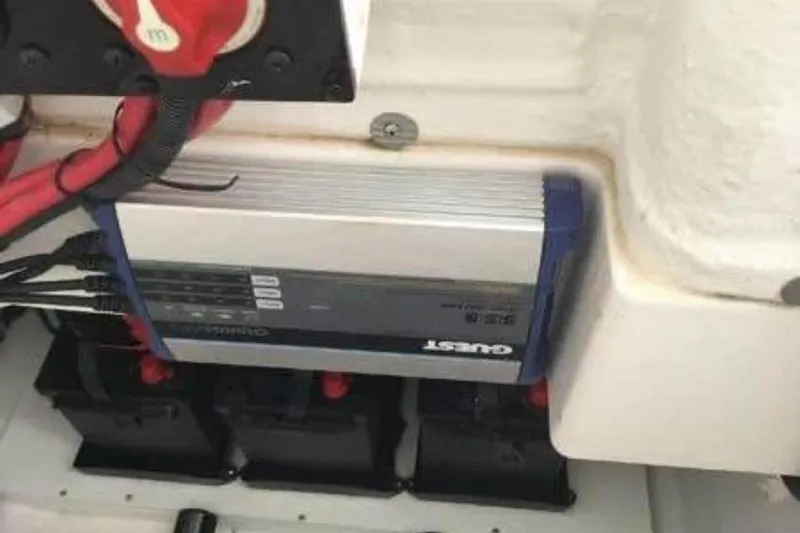 Slide: The Image of Electrical system of 2022 Aquasport 2500 Center Console boat with battery charger. - 13