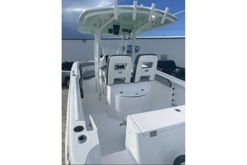 Slide: The Image of 2022 Aquasport 2500 Center Console boat with spacious deck and modern seating. - 6