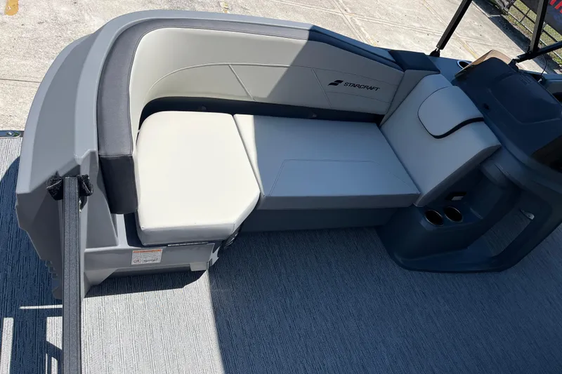 Slide: The Image of 2026 Starcraft GX 18 R boat interior with gray seating and cup holders. - 19