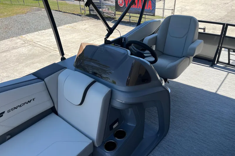 Slide: The Image of 2026 Starcraft GX 18 R boat interior with modern seating and steering console. - 20