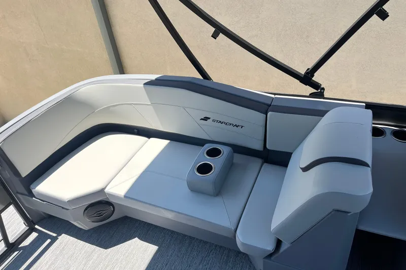 Slide: The Image of 2026 Starcraft GX 18 R boat interior with sleek seating and cup holders. - 23
