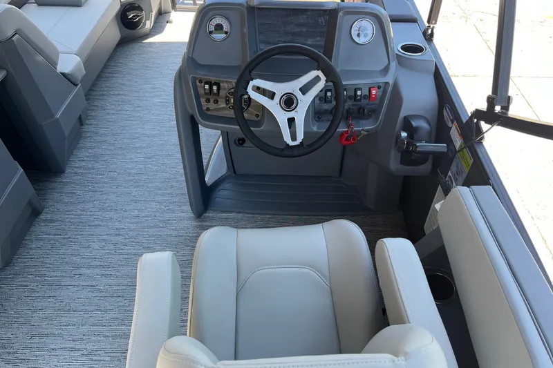 Slide: The Image of Interior view of 2026 Starcraft GX 18 R boat cockpit with steering wheel and controls. - 27