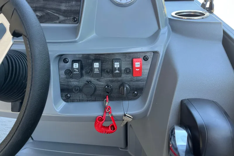 Slide: The Image of Dashboard controls of 2026 Starcraft GX 18 R boat with steering wheel and switches. - 29