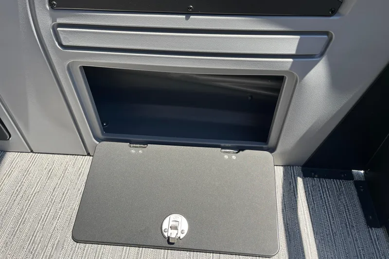Slide: The Image of 2026 Starcraft GX 18 R storage compartment with open hatch, showcasing interior space. - 34