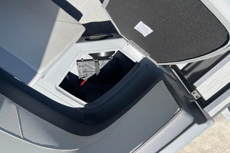 Slide: The Image of Open storage compartment in 2026 Starcraft GX 18 R boat, showcasing interior design. - 35