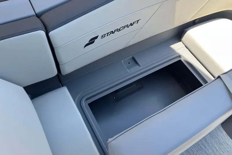 Slide: The Image of Starcraft GX 18 R 2026 boat interior storage compartment with cushioned seating. - 41