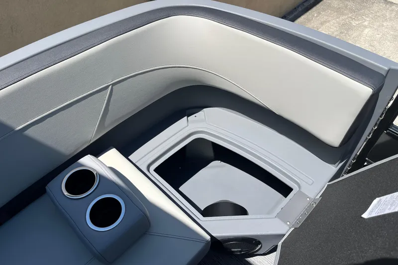 Slide: The Image of Interior seating of 2026 Starcraft GX 18 R boat with cup holders and storage compartment. - 42