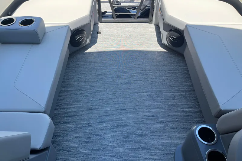 Slide: The Image of Interior of 2026 Starcraft GX 18 R boat with cushioned seating and cup holders. - 43
