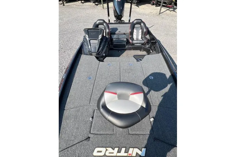 The Image of 2024 Nitro Z21 XL boat interior with seating and carpeted deck. - 1