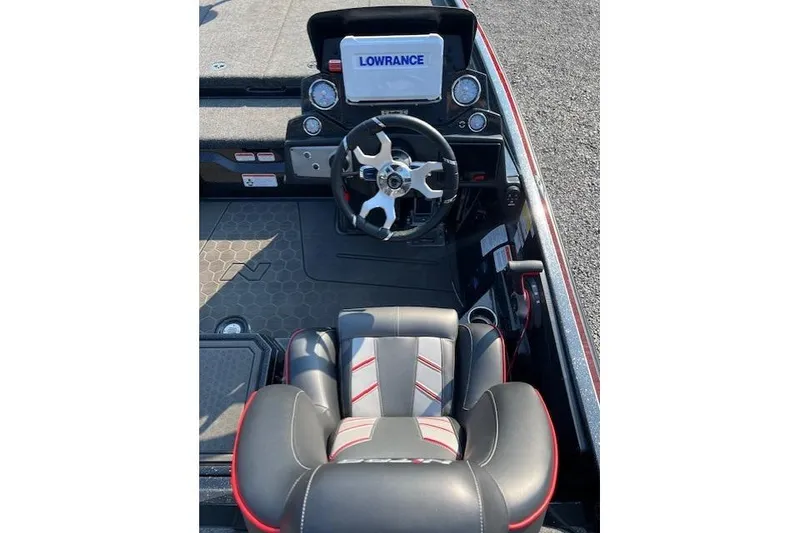Slide: The Image of 2024 Nitro Z21 XL boat cockpit with steering wheel and Lowrance display. - 5