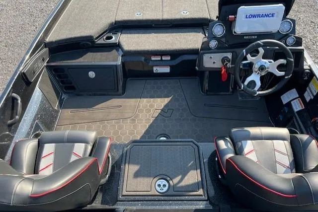 Slide: The Image of 2024 Nitro Z21 XL boat interior with dual seats, steering wheel, and Lowrance electronics. - 6