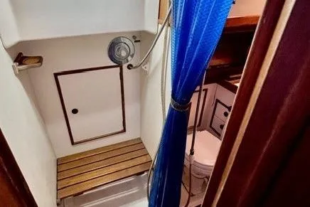 Slide: The Image of 1983 Nonsuch Cat Ketch boat interior with shower and toilet area. - 16
