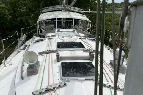 Slide: The Image of 1983 Nonsuch Cat Ketch sailboat deck with hatches and rigging. - 5