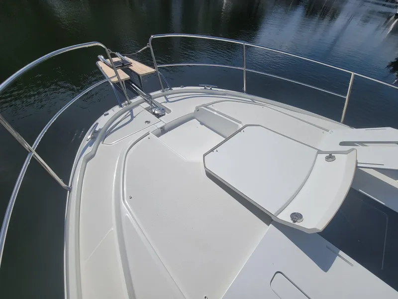 Slide: The Image of Bow view of 2020 Jeanneau NC1095 boat with sleek deck design. - 17
