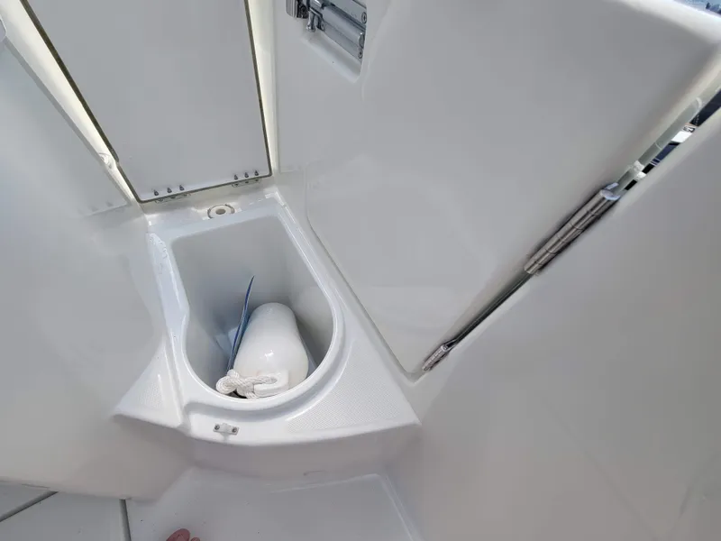 Slide: The Image of 2020 Jeanneau NC1095 boat toilet compartment, featuring a compact and modern design. - 18