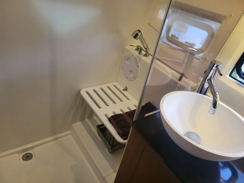 Slide: The Image of Bathroom interior of 2020 Jeanneau NC1095 boat with modern fixtures and shower area. - 35