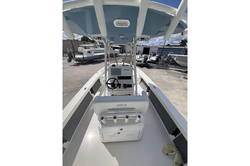 Slide: The Image of 2023 Pathfinder 2400 TRS boat interior with steering console and seating. - 10