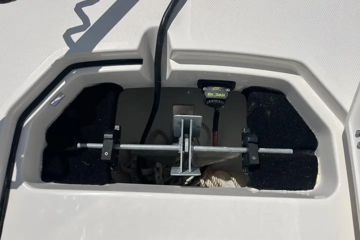 Slide: The Image of Anchor storage compartment on a 2023 Pathfinder 2400 TRS boat, featuring secure fittings. - 19