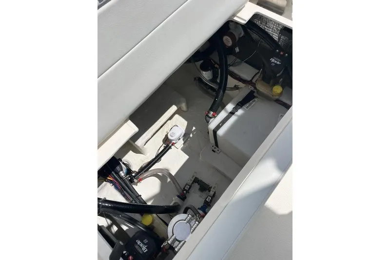 Slide: The Image of 2023 Pathfinder 2400 TRS boat interior showing wiring and mechanical components. - 4