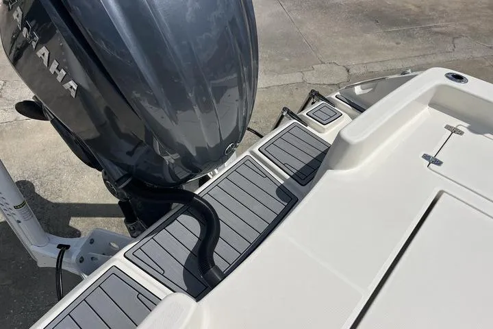 Slide: The Image of 2023 Pathfinder 2400 TRS boat with Yamaha engine, featuring sleek deck design. - 9