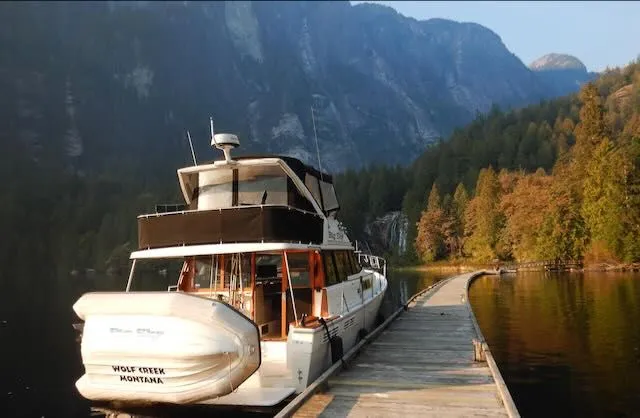 The Image of 1990 Bayliner 3888 Motoryacht docked at scenic pier. - 0