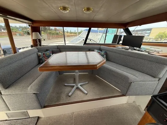 Slide: The Image of 1990 Bayliner 3888 Motoryacht interior with cozy seating area. - 15