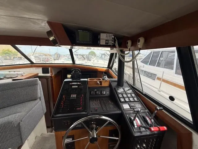 Slide: The Image of Interior view of 1990 Bayliner 3888 Motoryacht helm with instruments. - 18