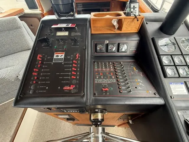 Slide: The Image of 1990 Bayliner 3888 Motoryacht dashboard with controls and gauges. - 21