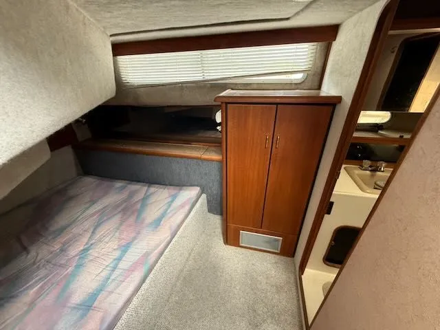 Slide: The Image of 1990 Bayliner 3888 Motoryacht interior with bed and cabinet. - 27