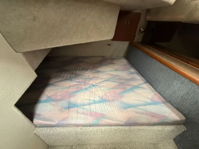 Slide: The Image of Interior of 1990 Bayliner 3888 Motoryacht with sleeping area. - 28