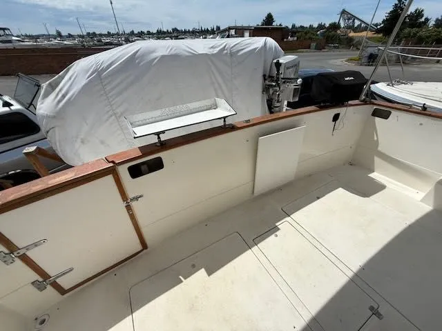 Slide: The Image of Deck area of a 1990 Bayliner 3888 Motoryacht in harbor. - 3