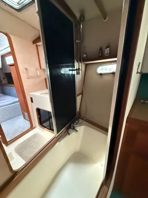 Slide: The Image of Interior view of 1990 Bayliner 3888 Motoryacht bathroom. - 32