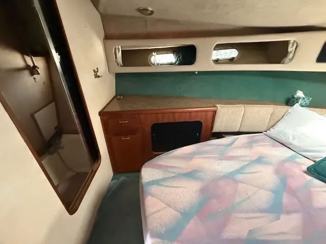 Slide: The Image of Interior of 1990 Bayliner 3888 Motoryacht with bed and storage. - 34