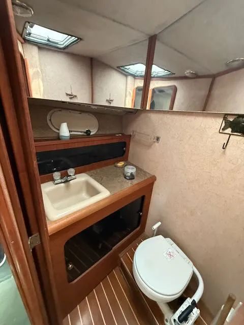 Slide: The Image of Interior view of 1990 Bayliner 3888 Motoryacht bathroom. - 36