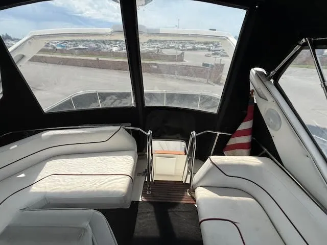 Slide: The Image of Interior of a 1990 Bayliner 3888 Motoryacht with white seating. - 41