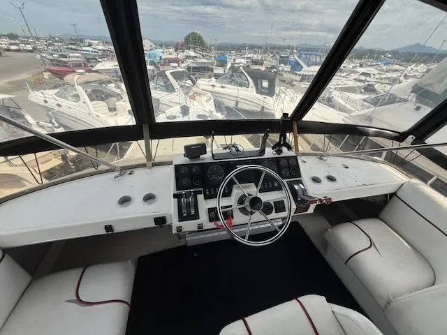 Slide: The Image of Interior view of 1990 Bayliner 3888 Motoryacht at marina. - 42