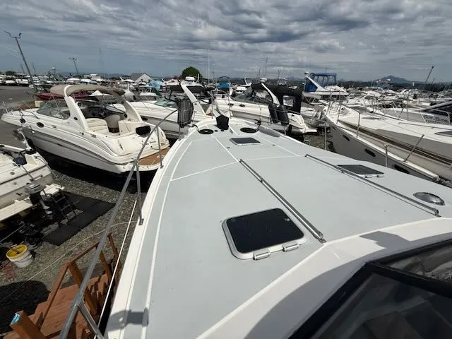 Slide: The Image of 1990 Bayliner 3888 Motoryacht docked at a marina. - 47