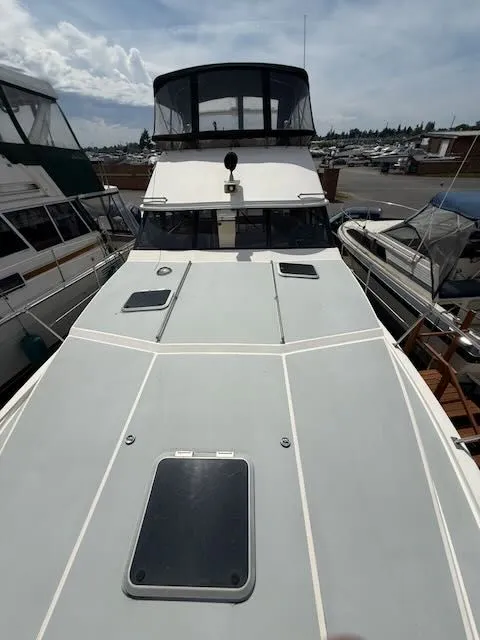 Slide: The Image of 1990 Bayliner 3888 Motoryacht docked at marina. - 49