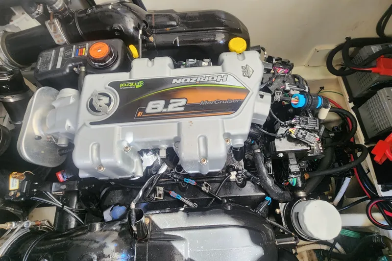 Slide: The Image of Engine of a 2019 Sea Ray Sundancer 350 Coupe, featuring a MerCruiser 8.2 engine. - 22