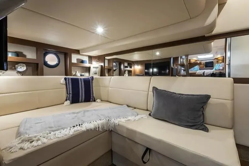 Slide: The Image of Luxurious interior of 2019 Sea Ray Sundancer 350 Coupe with plush seating and elegant decor. - 25