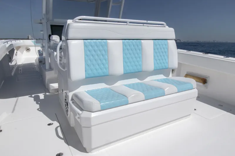 Slide: The Image of 2019 Invincible 40 Catamaran with blue and white seating on deck. - 10