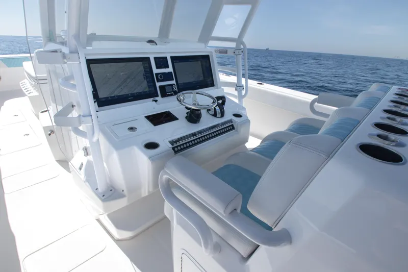 Slide: The Image of 2019 Invincible 40 Catamaran helm with dual screens and ocean view. - 16