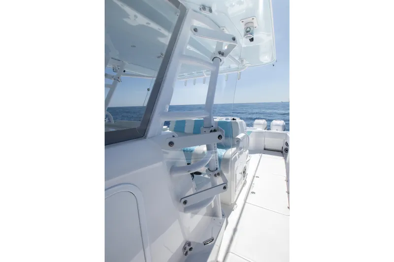 Slide: The Image of 2019 Invincible 40 Catamaran interior with ocean view, showcasing sleek design and seating. - 18